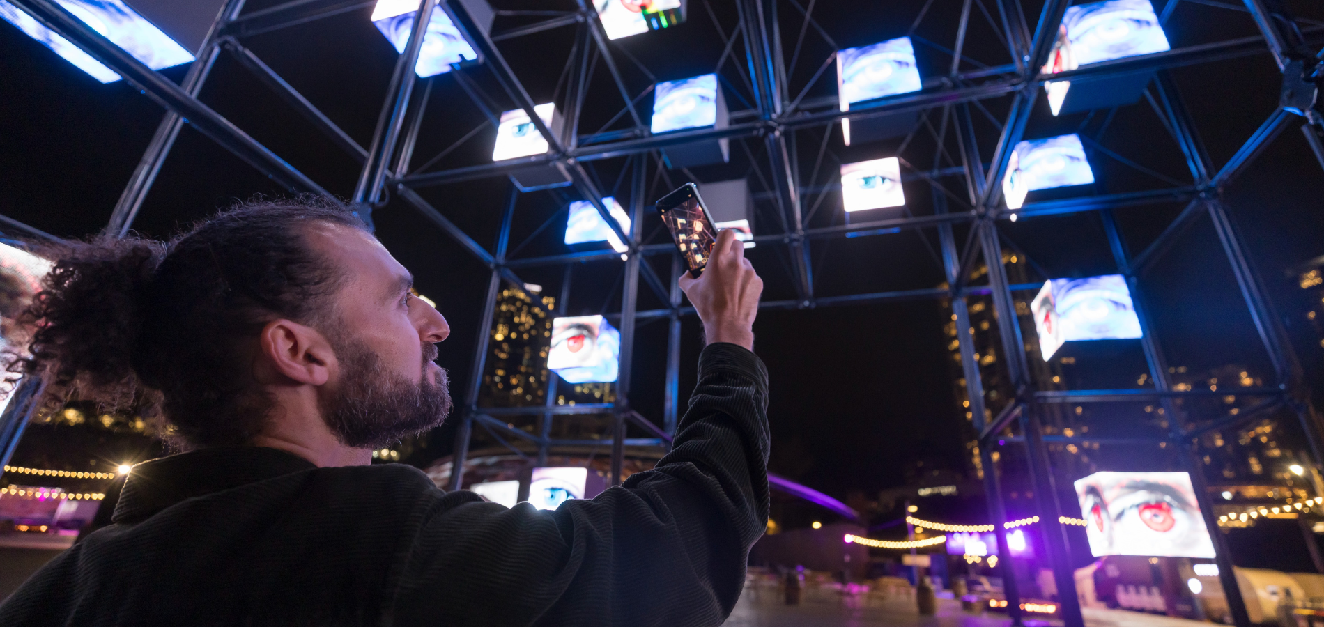A man taking a photo with his Samsung phone