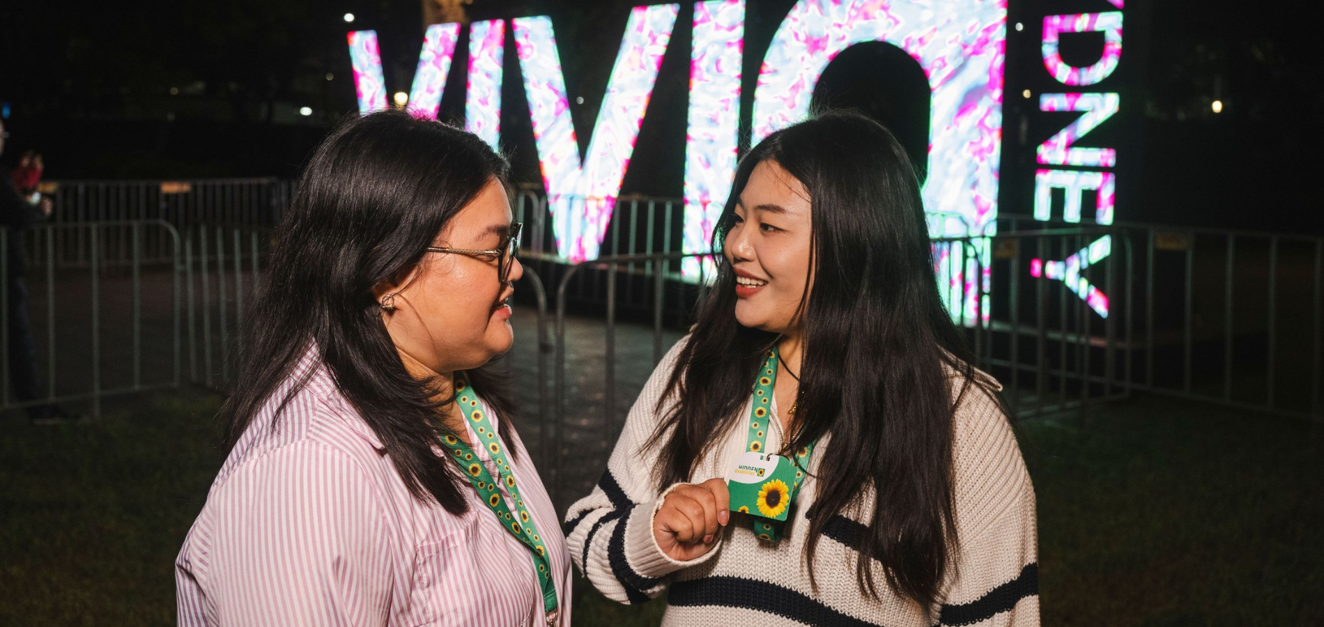 Women wearing hidden disability sunflower lanyards