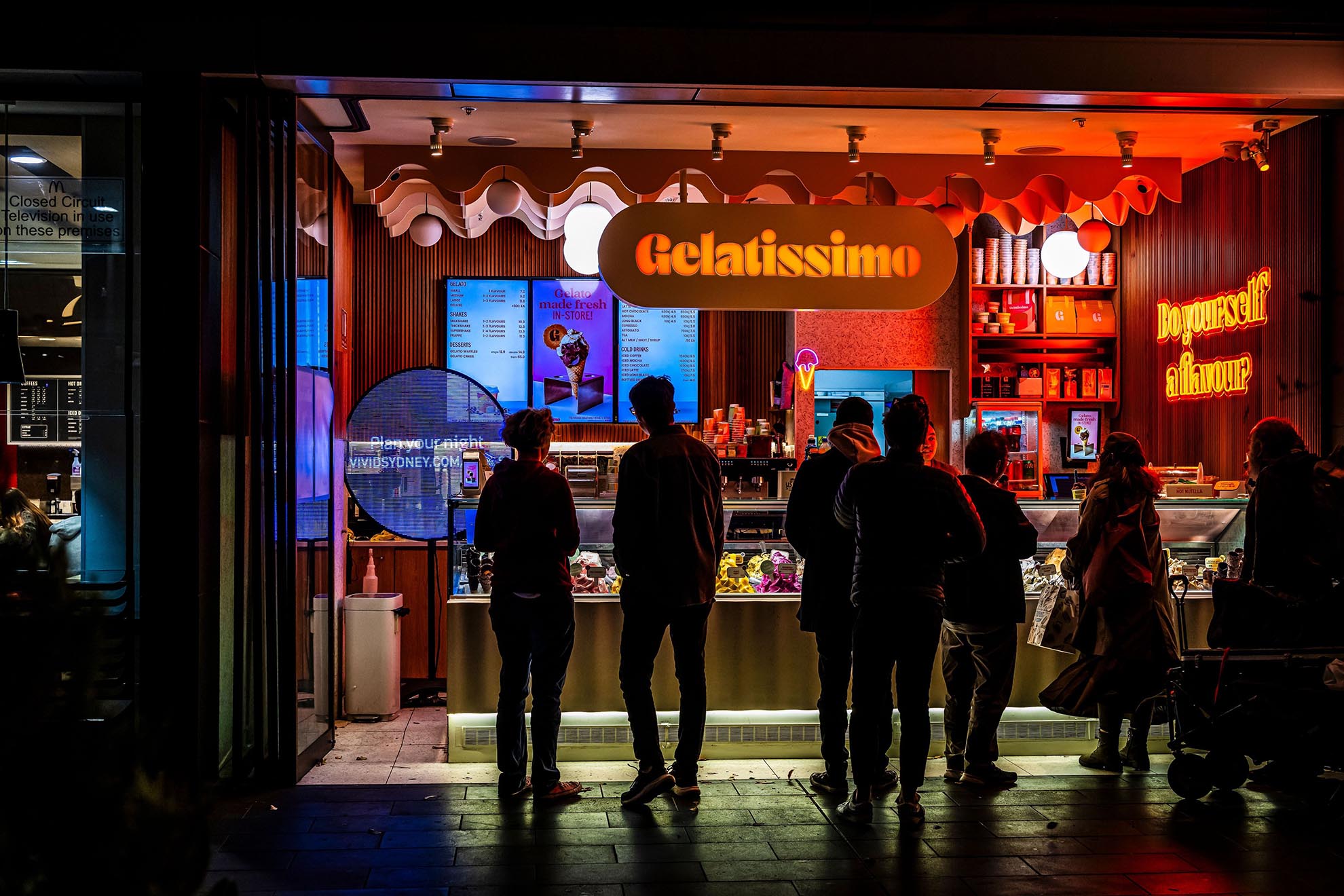 Local businesses display Vivid colours and signage during Vivid Sydney, Vivid Sydney 2025